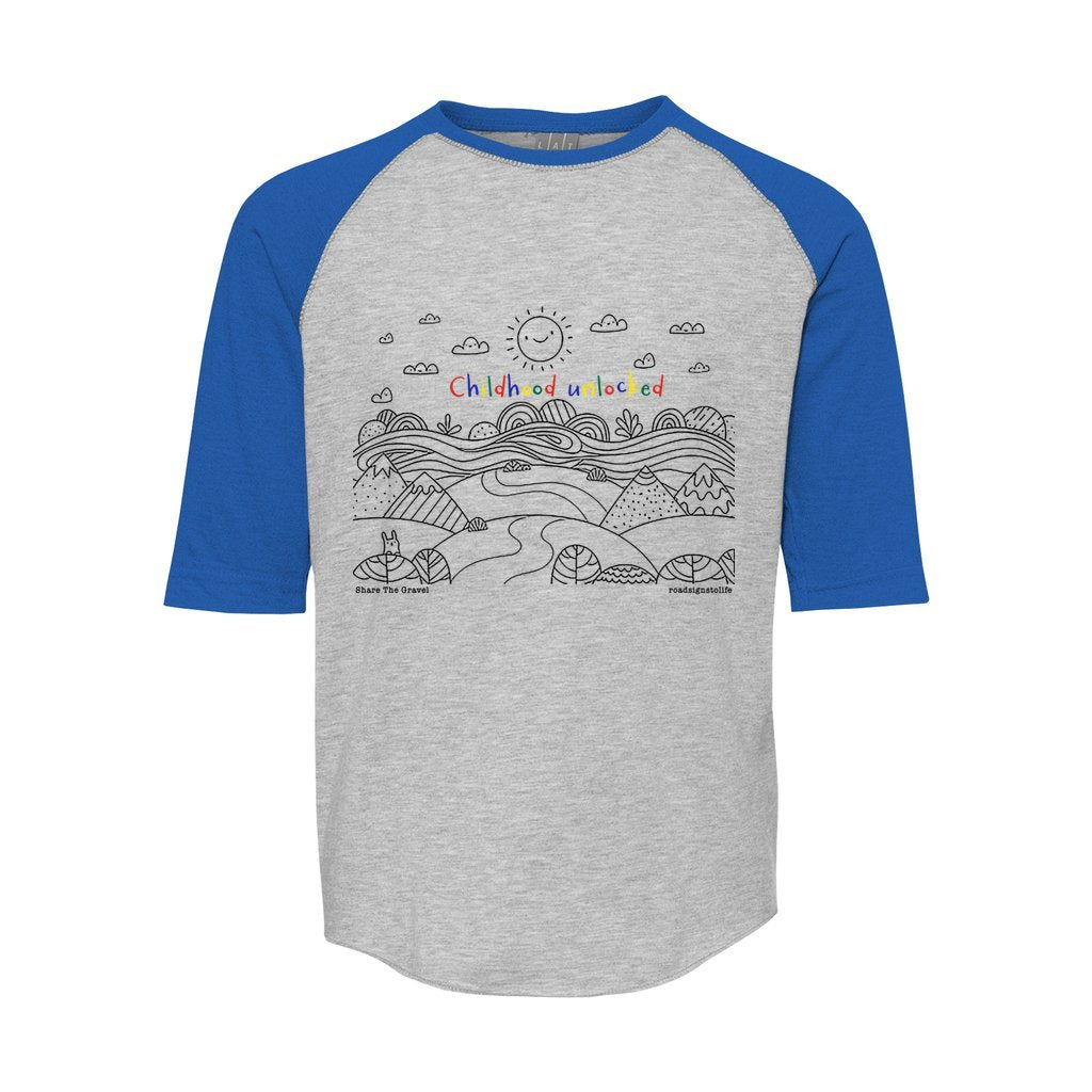 Child's line drawing of mountain range with "Childhood unlocked" written in primary colors. Cotton raglan jersey baseball tee. Youth t-shirt with 3/4 sleeves. Heather gray shirt with blue sleeves and collar.