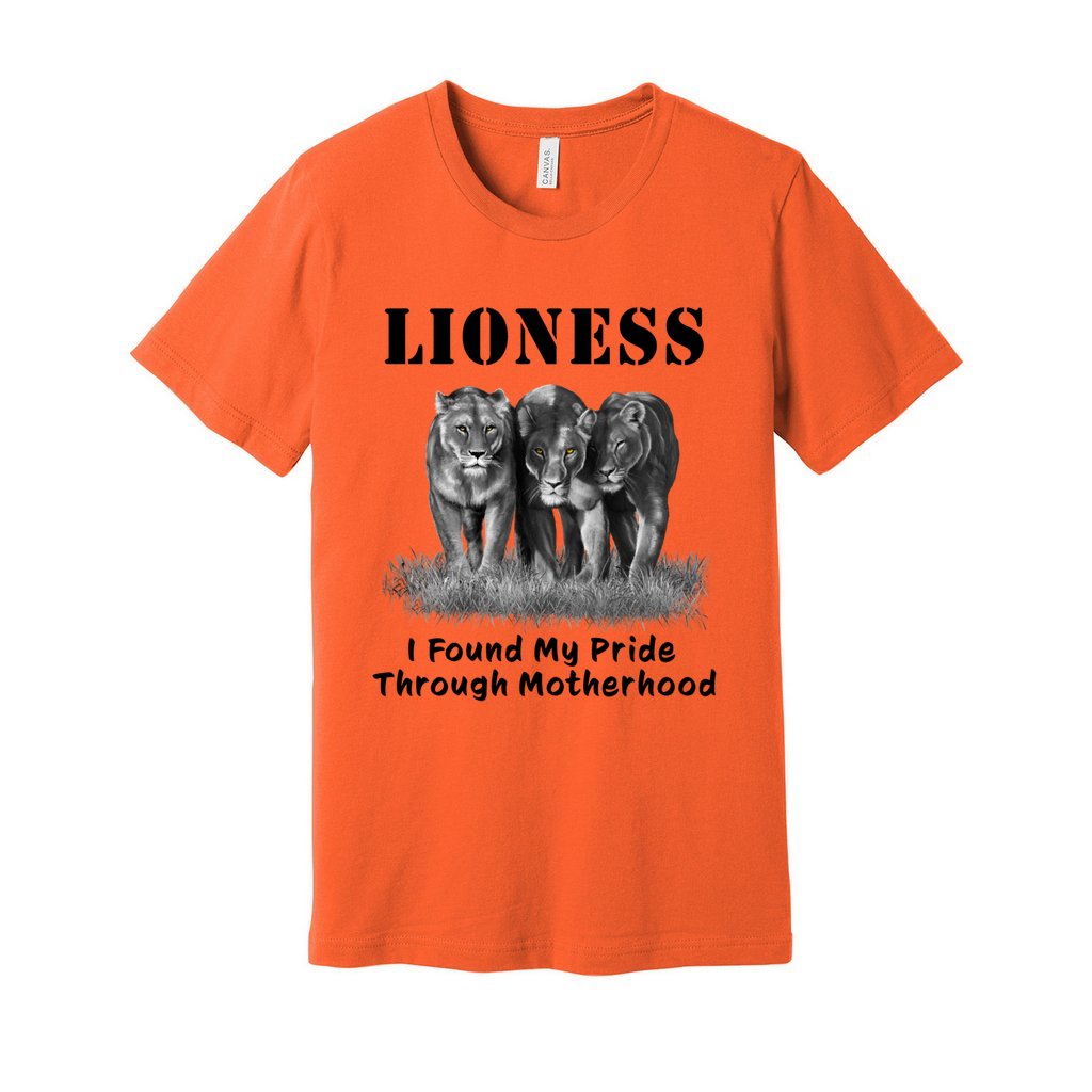 "Lioness" written above three female lions, with "I Found My Pride Through Motherhood" written below. Adult cotton T-shirt. Orange.