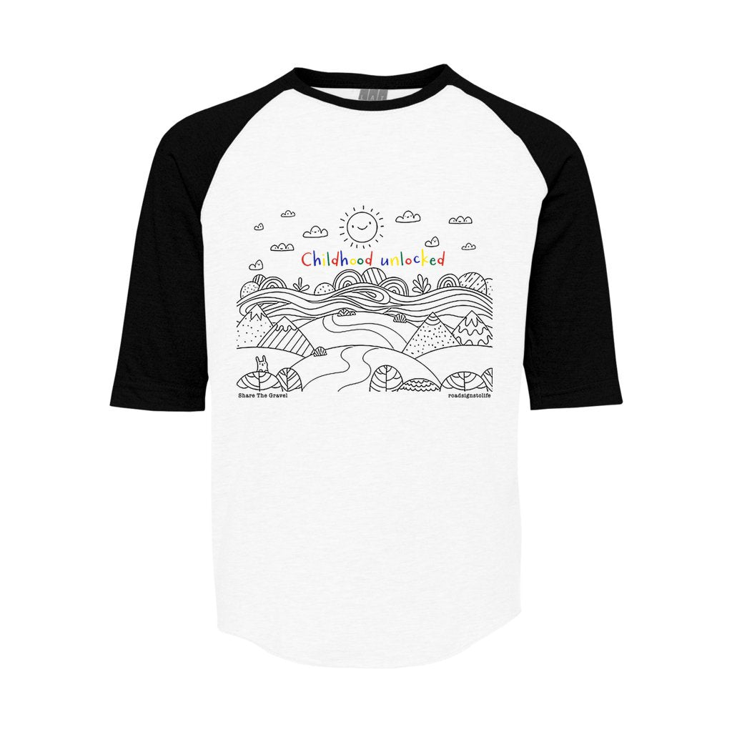 Child's line drawing of mountain range with "Childhood unlocked" written in primary colors. Cotton raglan jersey baseball tee. Youth t-shirt with 3/4 sleeves. White shirt with black sleeves and collar.