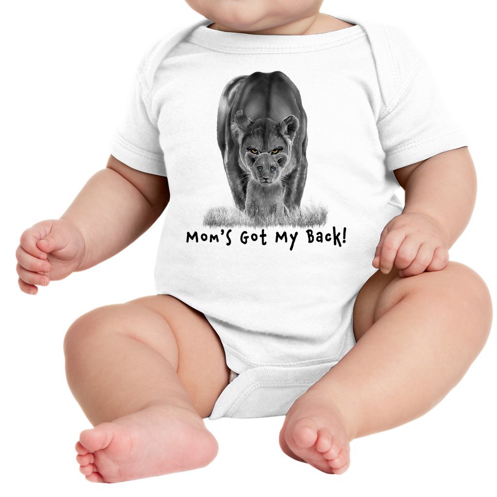 A lioness standing behind her sitting cub, with the words "Mom's Got My Back!" written below it on an infant onesie. White.