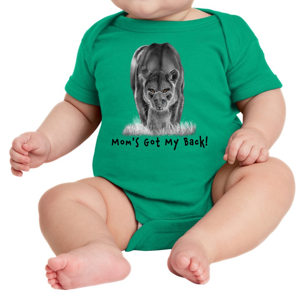 A lioness standing behind her sitting cub, with the words "Mom's Got My Back!" written below it on an infant onesie. Kelly Green.