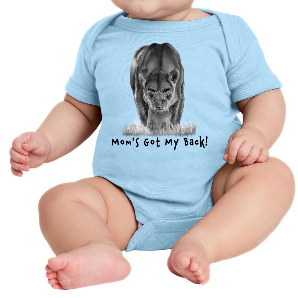 A lioness standing behind her sitting cub, with the words "Mom's Got My Back!" written below it on an infant onesie. Light Blue.