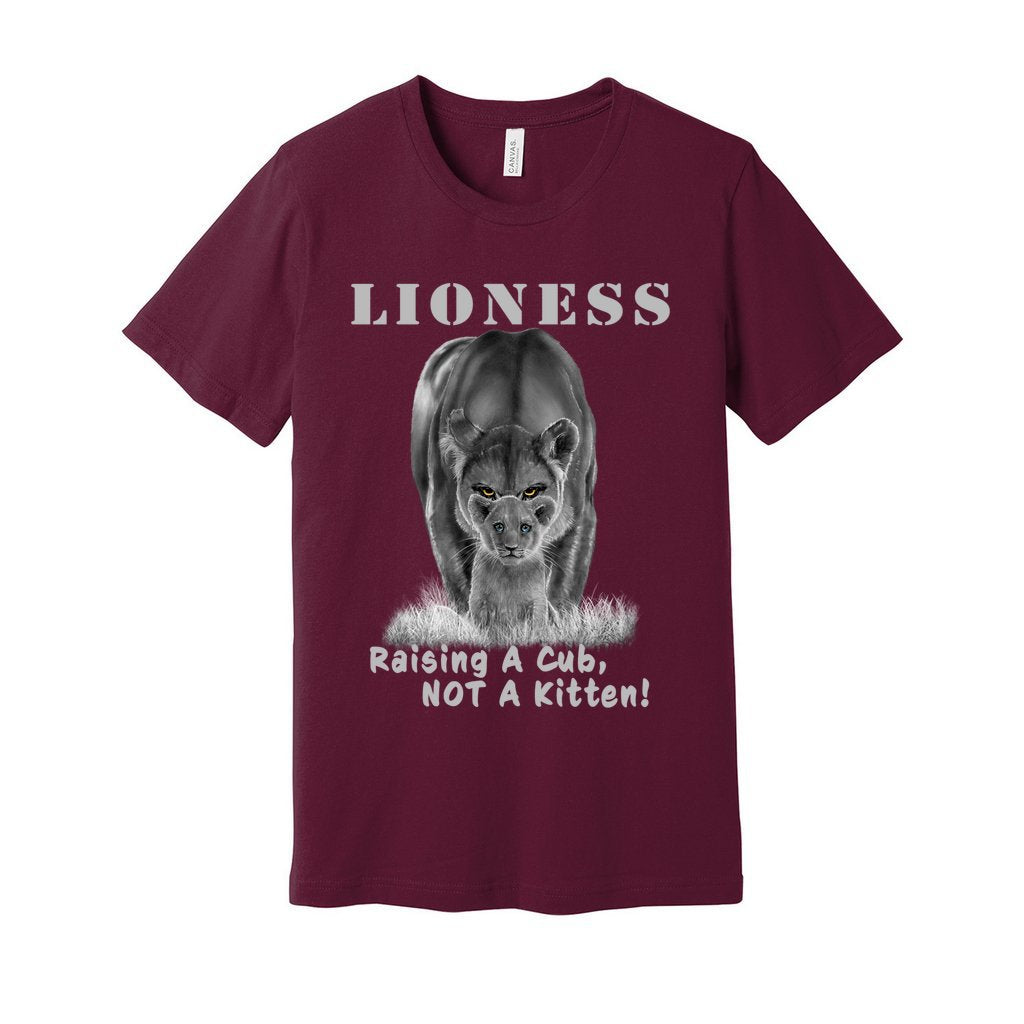 "Lioness" written above an adult female lion with her cub sitting in front of her, with "Raising A Cub, NOT A Kitten" written below. Adult cotton t-shirt. Maroon.